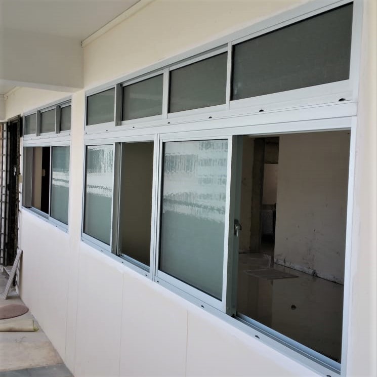 Aluminum sliding windows on a building exterior - Home Aluminium Windows & Grilles Singapore